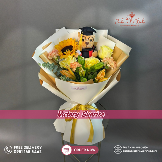 Victory Sunrise Bouquet featuring a graduation bear, sunflower, yellow roses, orange stargazer lilies, two tone carnations, and fresh eucalyptus, a bright and celebratory floral arrangement perfect for graduation ceremonies, achievements, and special occasions in the Philippines.
